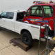 Image for article titled The 2021 Ford F-250 Lariat Tremor With A Ramp Kit Makes A Pretty Great Way To Haul A Changli Across The Country